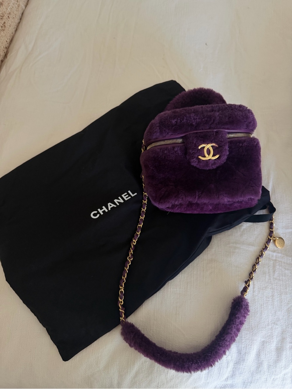 Chanel Purple Shearling vanity Crossbody bag.